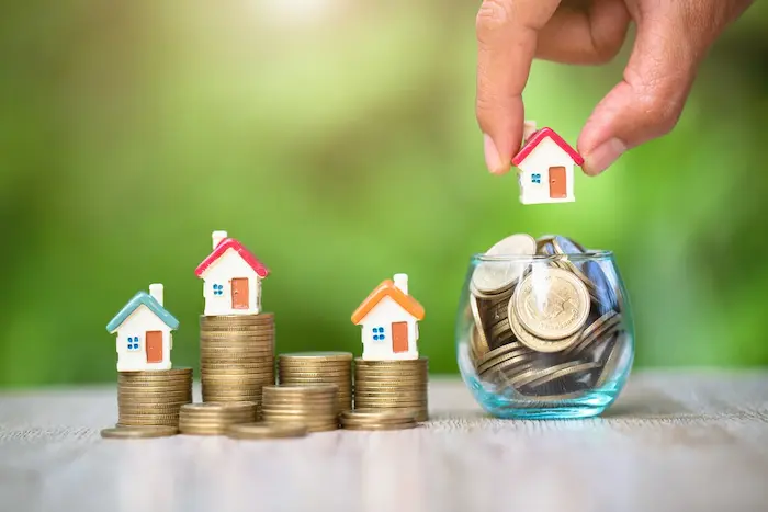 Image de pièces et maisonnettes, représentant l'importance de la recherche de logement étudiant pas cher pour les étudiants